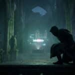 A cloaked figure crouches in a ruined gothic church, observing a glowing, abstract holographic projection. Eerie green light illuminates the scene.