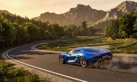 A vibrant metallic electric blue hypercar speeds on a winding road in a lush Japanese mountain landscape at golden hour, with a pagoda and torii gate.