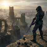 A lone warrior in dark combat armor with a glowing rifle stands on a cliff, surveying a vast, misty landscape of ancient ruins under a dramatic sky.